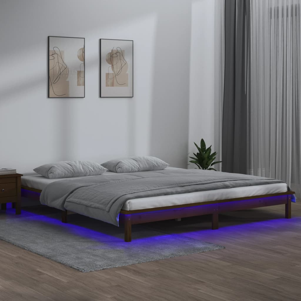 Estrutura de cama c/ LED 140x190 cm madeira maciça castanho-mel