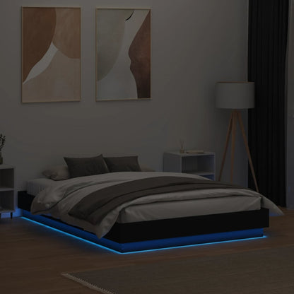 Estrutura de cama com luzes LED 140x190 cm preto