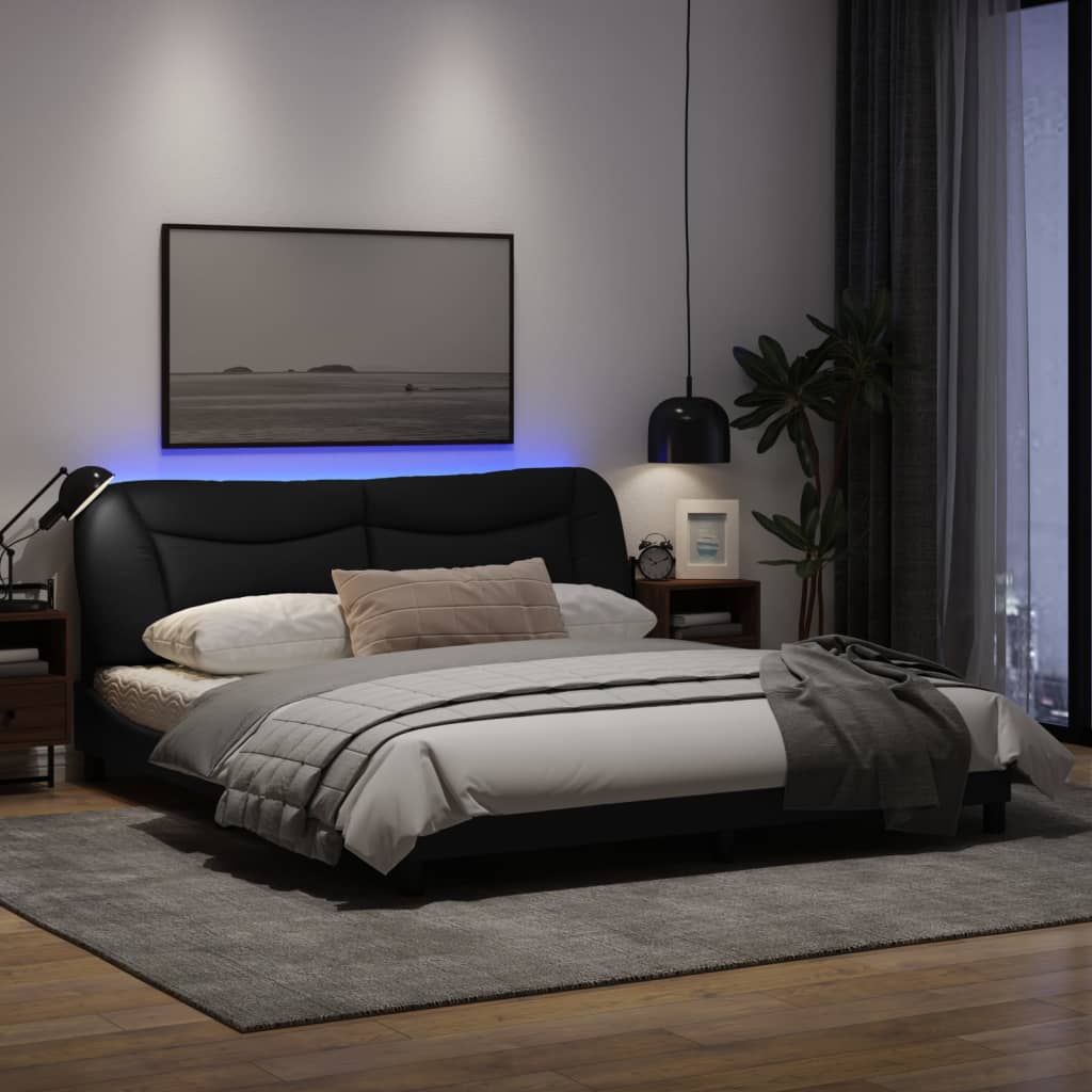 Estrutura de cama com luzes LED 180x200 cm tecido preto